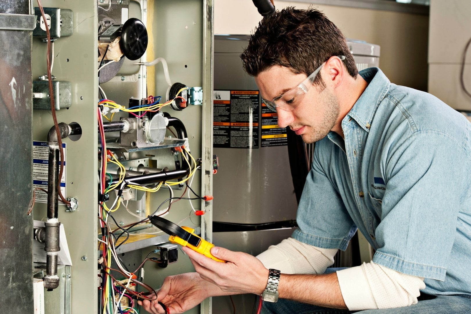 A man providing furnace services.