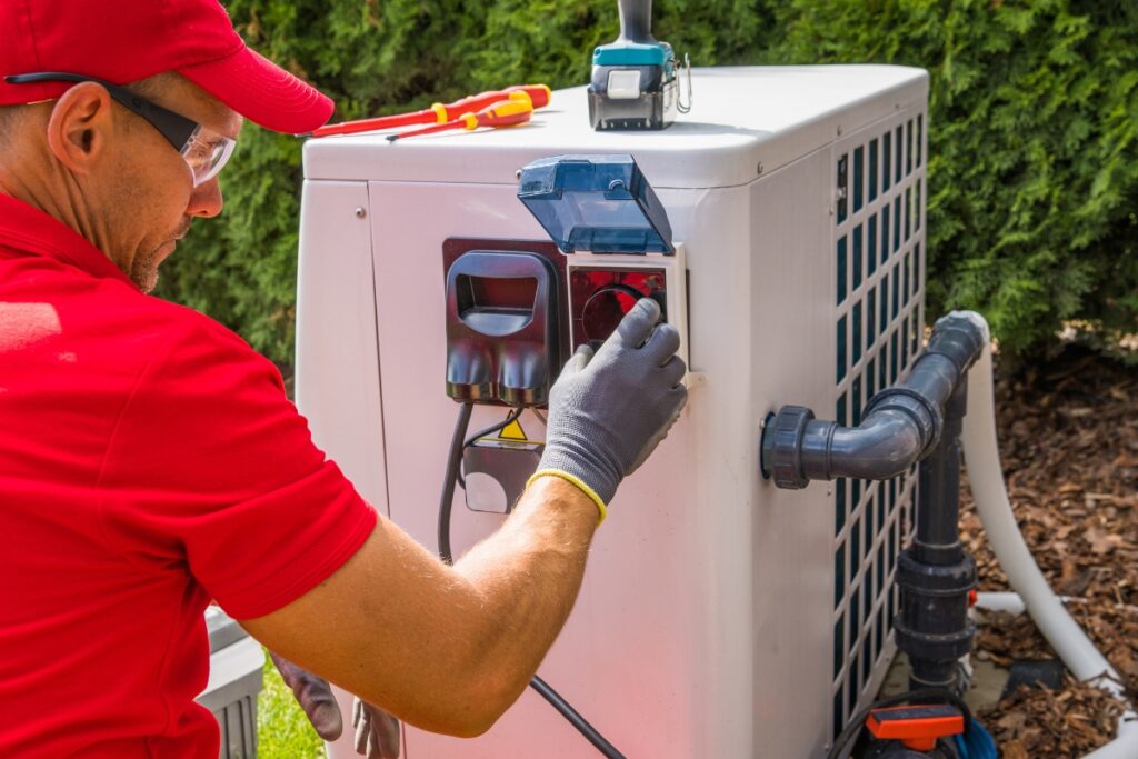 Technician servicing an outdoor air conditioning unit for optimal Georgia climate control.
