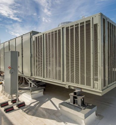 A commercial air conditioning unit on top of a building.