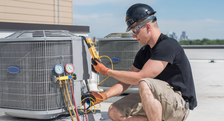 A man performing hvac replacement on a roof.