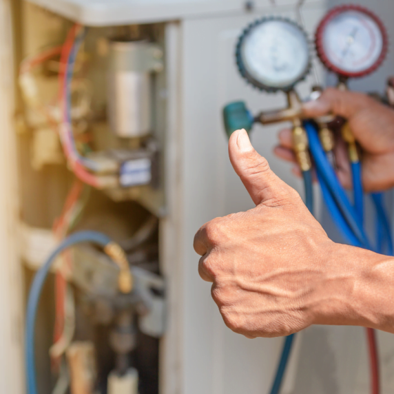 A man approving an air conditioner, showcasing Atlanta HVAC expertise.