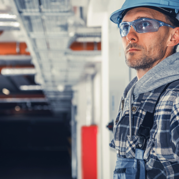 A construction worker equipped with a hard hat and safety glasses representing Duluth HVAC Company.