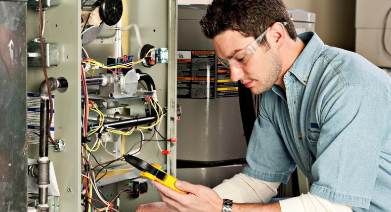 A man providing furnace services.