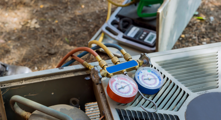 An air conditioner equipped with a gauge for heat pump maintenance.