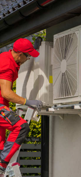 A man from Hiram HVAC company working on an air conditioner.