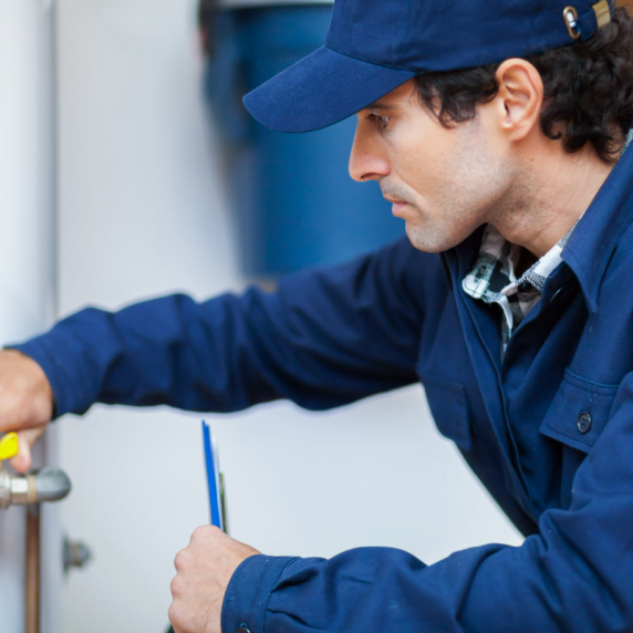 A technician from the Lawrenceville HVAC Company working on some furnace repair.