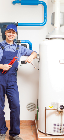 A technician standing next to a water heater.