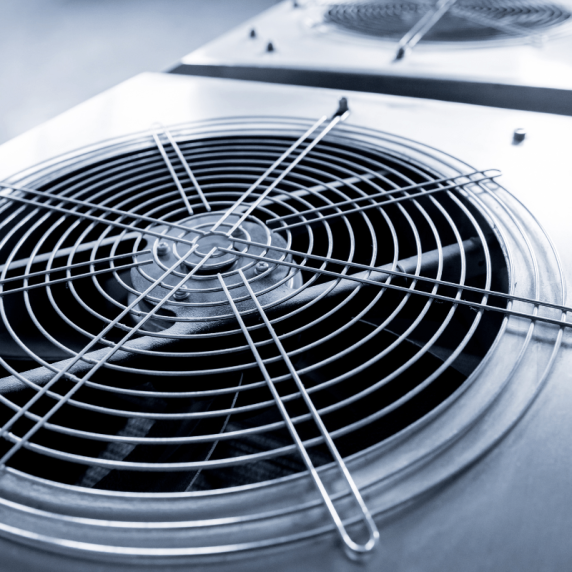 A close up of a cooling fan in a factory installed by the Marietta HVAC company.