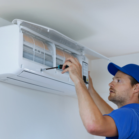 A Marietta HVAC technician repairing an air conditioner.