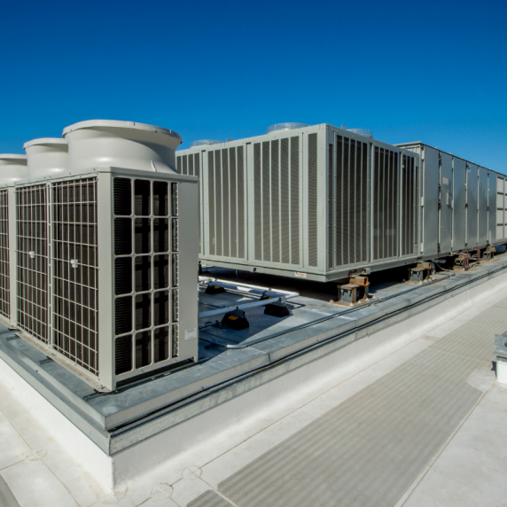 A group of air conditioning units on a roof maintained by the Smyrna HVAC Company.